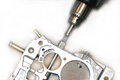 Throttle shaft repair tool with Quadrajet carb